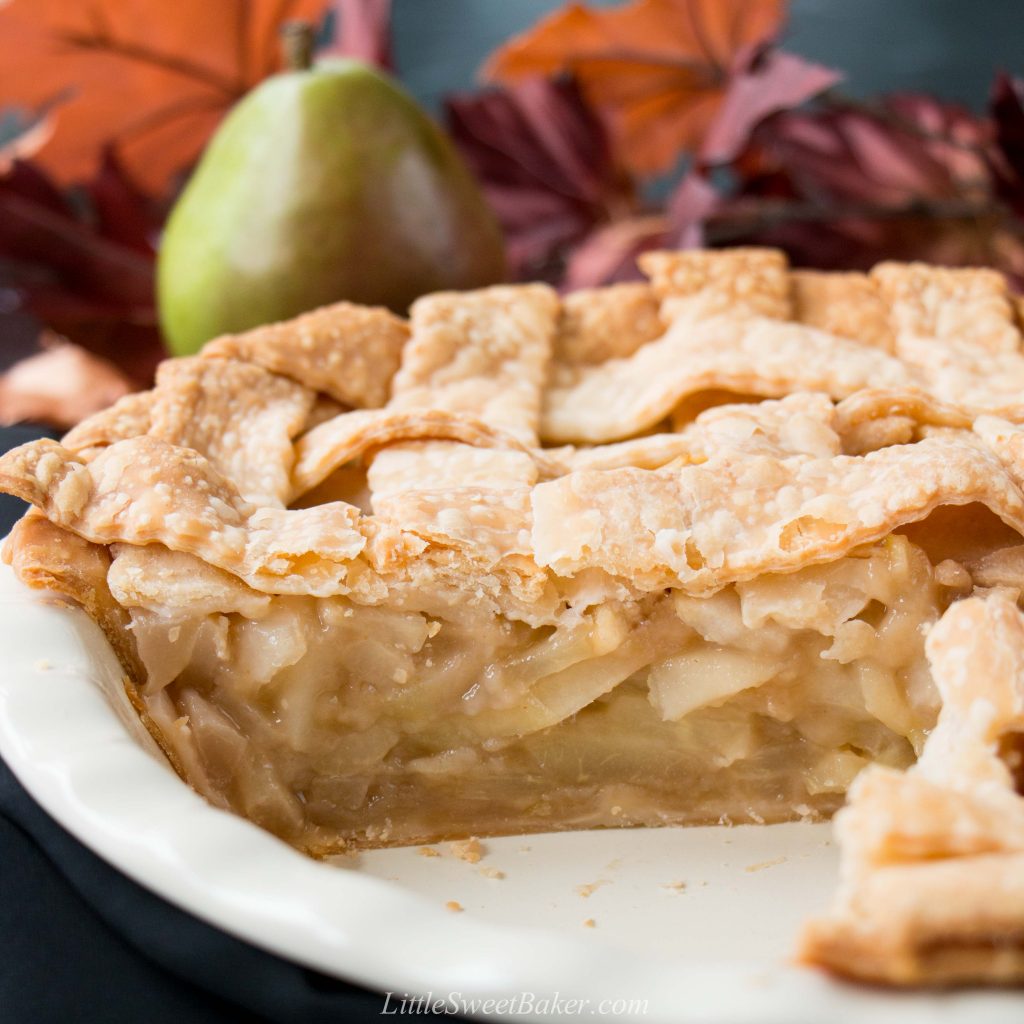 This incredible pear pie is sweetened with maple syrup and lightly spiced with ginger. The filling is made with fresh pears which gives it a lovely tender-crisp texture. #pearpie #gingerpearpie #maplepearpie #easypearpie