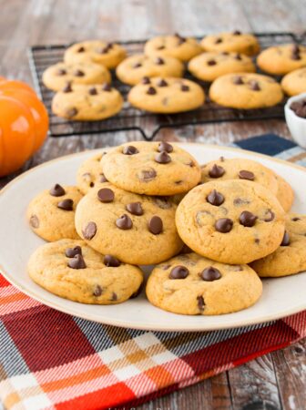 These soft and chewy pumpkin chocolate chip cookies are a perfect taste of fall. They have a lovely pumpkin flavor, lightly spiced and just the right amount of chocolate in every bite! #pumpkinchocolatechipcookies #chewypumpkinchocolatecookies #bestpumpkinchocolatechipcookies