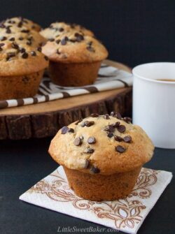 The BEST chocolate chip muffin recipe - soft, moist and fluffy, loaded with chocolate chips and a perfect crispy sky-high muffin top! Hundreds of rave review. #chocolatechipmuffins #easychocolatechipmuffins #bestchocolatechipmuffins #moistchocolatechipmuffins