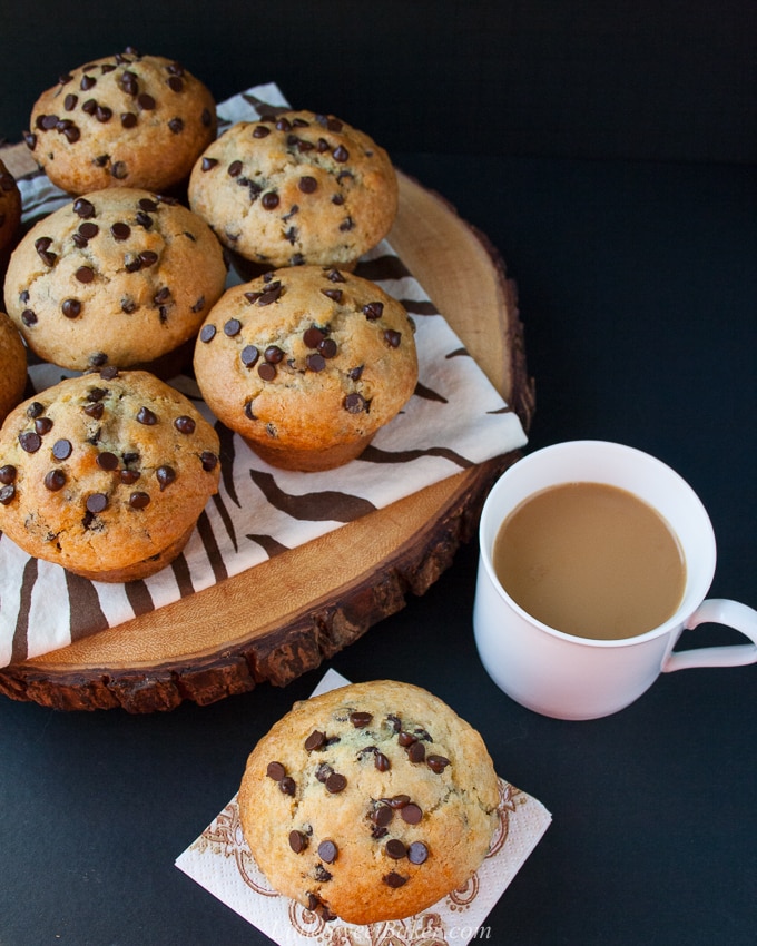 The BEST chocolate chip muffin recipe - soft, moist and fluffy, loaded with chocolate chips and a perfect crispy sky-high muffin top! Hundreds of rave review. #chocolatechipmuffins #easychocolatechipmuffins #bestchocolatechipmuffins #moistchocolatechipmuffins