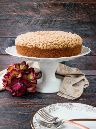 A streusel topped moist coffee cake flavored with pumpkin and fall spices. #pumpkincake #pumpkinspicecake #pumpkincoffeecake