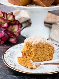 A streusel topped moist coffee cake flavored with pumpkin and fall spices. #pumpkincake #pumpkinspicecake #pumpkincoffeecake