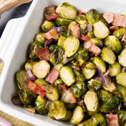 This easy one-pan roasted brussel sprouts is a perfect side dish to any meal. The bacon adds a smokey flavor to the crispy and sweet caramelized brussel sprouts. #roastedbrusselsprouts #Thanksgivingside #Thanksgivingrecipe