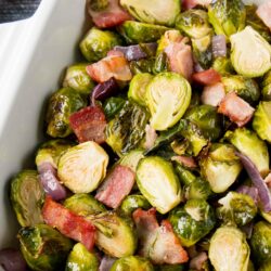 These easy one-pan roasted Brussels sprouts are a perfect side dish to any meal. The bacon adds a smokey flavor to the crispy and sweet caramelized Brussels sprouts. #roastedbrusselssprouts #Thanksgivingside #Thanksgivingrecipe