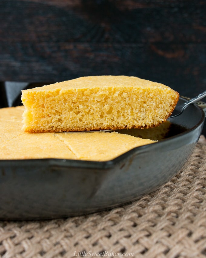 This one-bowl recipe for tender and buttery cornbread is baked in a cast iron skillet for a delightfully crispy crust. #cornbreadrecipe #skilletcornbread #buttermilkcornbread #castironcornbread