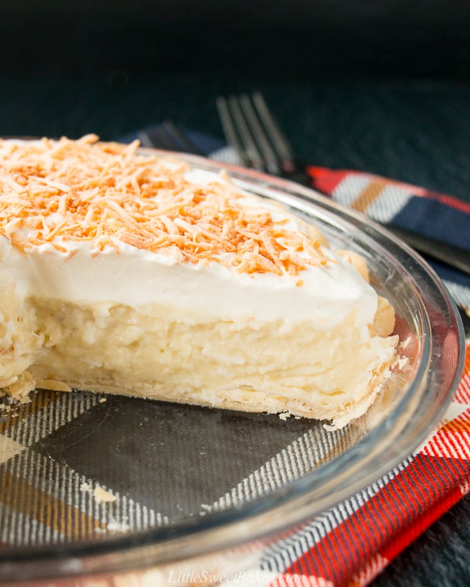 This homemade coconut cream pie is made with coconut milk and shredded coconut for the most flavorful and delicious custard filling you've ever tasted!#coconutcreampie #coconutmilk #flakypiecrust #Thanksgivingdessert