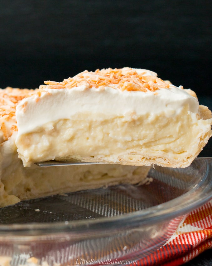 This homemade coconut cream pie is made with coconut milk and shredded coconut for the most flavorful and delicious custard filling you've ever tasted!#coconutcreampie #coconutmilk #flakypiecrust #Thanksgivingdessert