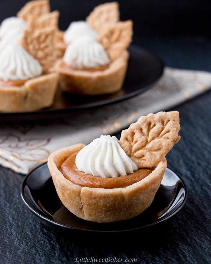 These individual mini pumpkin pies are creamy and perfectly flavored with pumpkin and spices. They are super easy to make and even easier to serve. #minipumpkinpie #individualpumpkinpies #Thanksgivingdessert