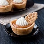 These individual mini pumpkin pies are creamy and perfectly flavored with pumpkin and spices. They are super easy to make and even easier to serve. #minipumpkinpie #individualpumpkinpies #Thanksgivingdessert