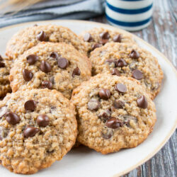 These cookies are crispy on the edges, soft in the middle, and loaded with chocolate chips. They are a perfect mix of decadent chocolate chip cookies and wholesome oatmeal cookies. #oatmealchocolatechipcookies #recipe