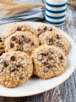 These cookies are crispy on the edges, soft in the middle, and loaded with chocolate chips. They are a perfect mix of decadent chocolate chip cookies and wholesome oatmeal cookies. #oatmealchocolatechipcookies #recipe