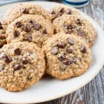 These cookies are crispy on the edges, soft in the middle, and loaded with chocolate chips. They are a perfect mix of decadent chocolate chip cookies and wholesome oatmeal cookies. #oatmealchocolatechipcookies #recipe