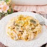 This turkey tetrazzini is creamy-cheesy good. It's filled with succulent chunks of turkey, silky mushrooms slices, onions, and spaghettini pasta baked in a creamy flavorful white sauce. #leftoverturkeyrecipe #turkeytetrazzini #turkeycasserole #pastacasserole