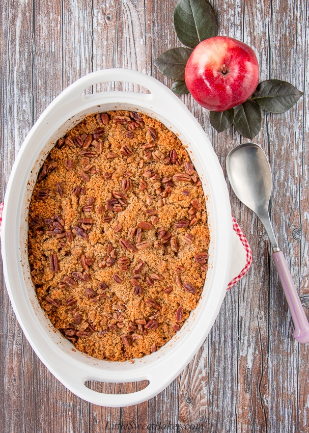 This wonderful casserole side dish is both sweet and savory. It's filled with tender chunks of apples and butternut squash, and it's topped with a buttery and crunchy pecan crumble. #holidaysidedish #butternutsquashcasserole #Thanksgivingsidedish #Christmassidedish