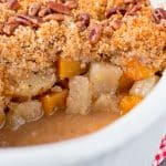 This wonderful casserole side dish is both sweet and savory. It's filled with tender chunks of apples and butternut squash, and it's topped with a buttery and crunchy pecan crumble. #holidaysidedish #butternutsquashcasserole #Thanksgivingsidedish #Christmassidedish
