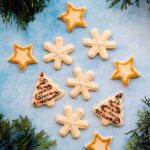 These soft baked sugar cookies are buttery, not too sweet, and taste amazing! They are just as fun and easy to make as they are to eat. #sugarcookies #cutout #recipe #Christmascookies