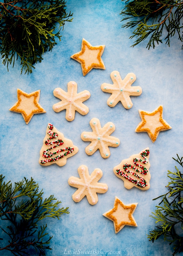 These soft baked sugar cookies are buttery, not too sweet, and taste amazing! They are just as fun and easy to make as they are to eat. #sugarcookies #cutout #recipe #Christmascookies