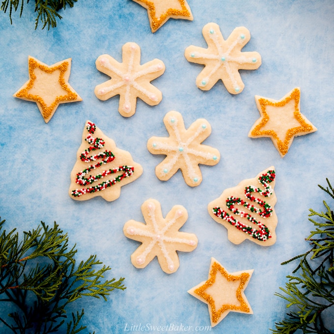 These soft baked sugar cookies are buttery, not too sweet, and taste amazing! They are just as fun and easy to make as they are to eat. #sugarcookies #cutout #recipe #Christmascookies