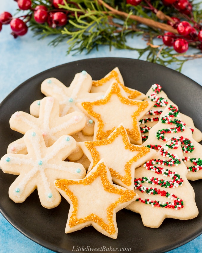 These soft baked sugar cookies are buttery, not too sweet, and taste amazing! They are just as fun and easy to make as they are to eat. #sugarcookies #cutout #recipe #Christmascookies