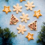 These soft baked sugar cookies are buttery, not too sweet, and taste amazing! They are just as fun and easy to make as they are to eat. #sugarcookies #cutout #recipe #Christmascookies