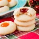 This classic holiday cookies is buttery and chewy with a delicious pocket of jam. #thumbprintcookies #Christmascookies #recipe #sugarcookie