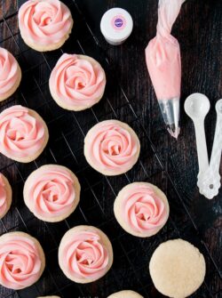 soft frosted sugar cookies on a cooling rack