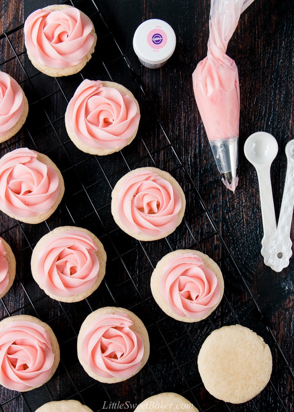 soft frosted sugar cookies on a cooling rack