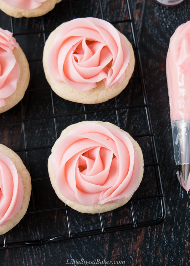 soft frosted sugar cookies on a cooling rack