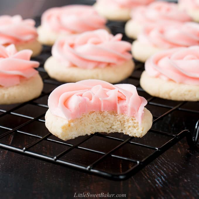 soft frosted sugar cookie with a bite out of it