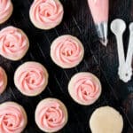 soft frosted sugar cookies on a cooling rack