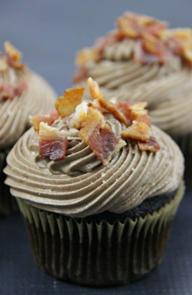 chocolate bacon cupcakes topped with chocolate buttercream and bacon