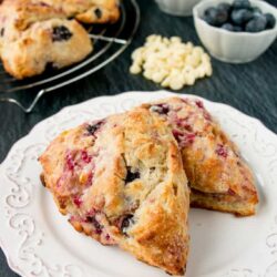 Two scones on a white plate.