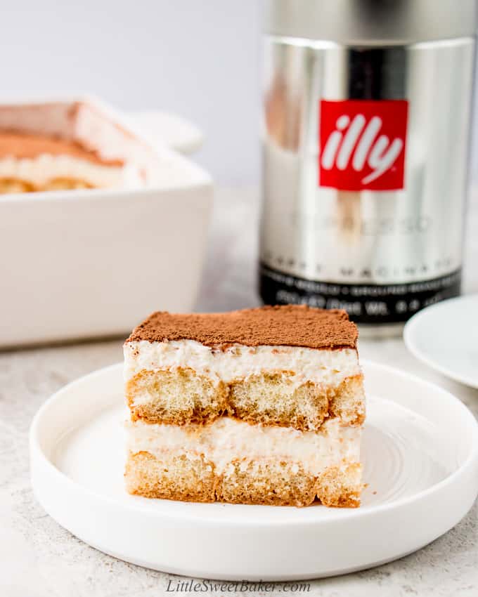 A slice of eggless tiramisu on a white plate.