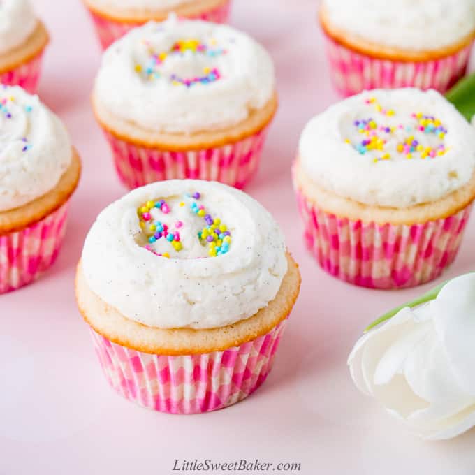 Moist vanilla cupcakes topped with vanilla buttercream and pastel sprinkles.