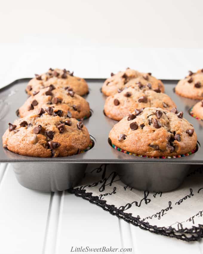 A muffin pan with banana chocolate chip muffins.