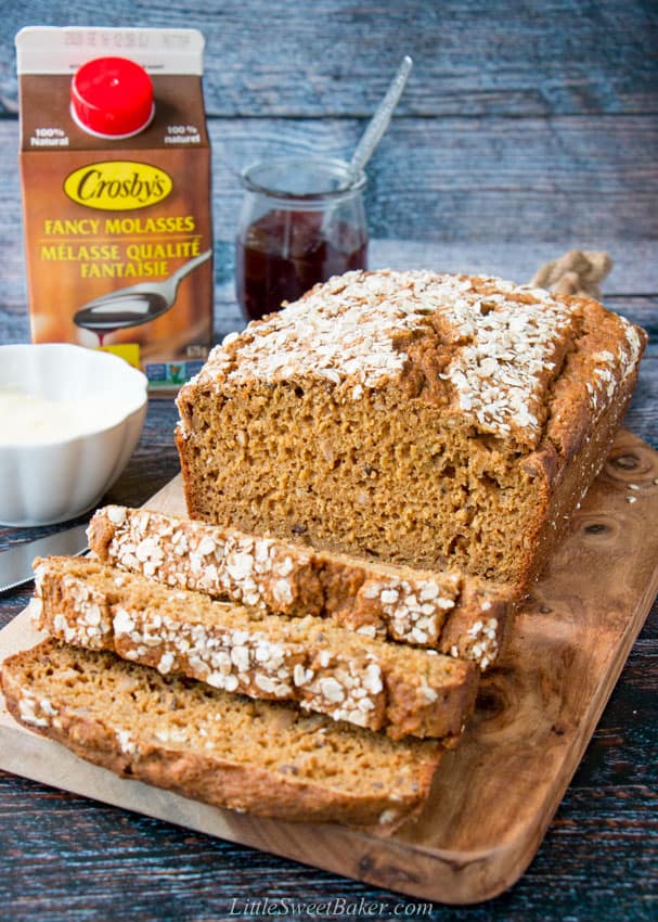 A loaf of quick brown bread on a cutting board.