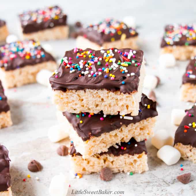 A stack of chocolate dipped rice krispie treats.