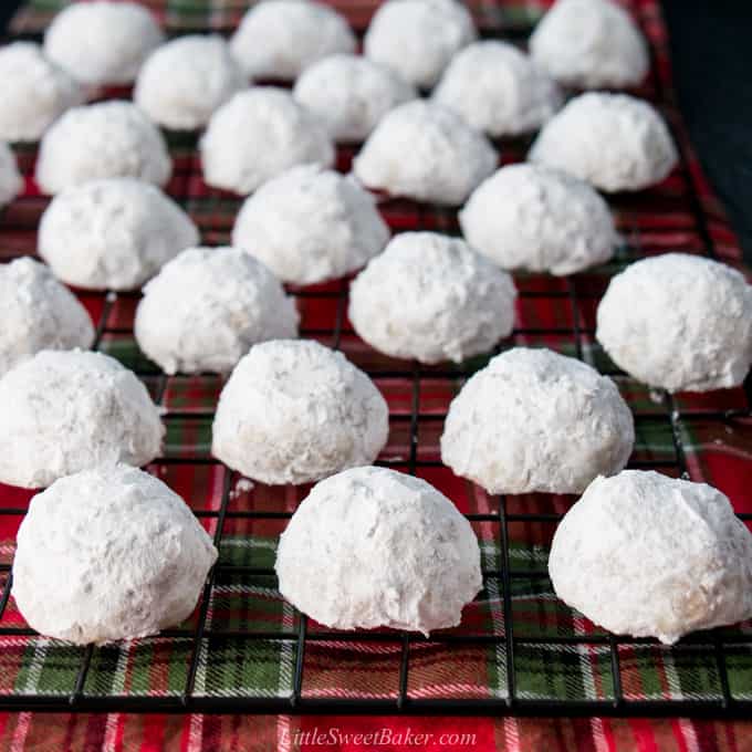snowball cookies on a cooling rack