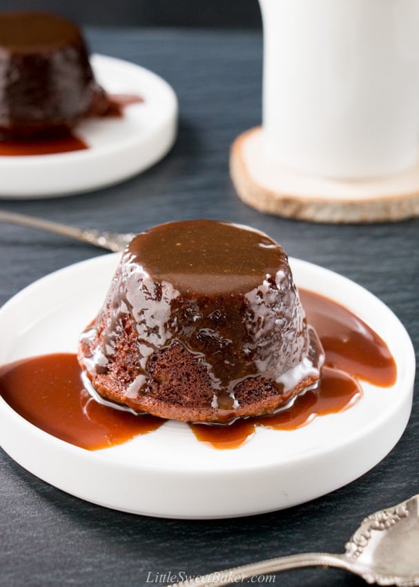 Sticky toffee pudding on a white plate.