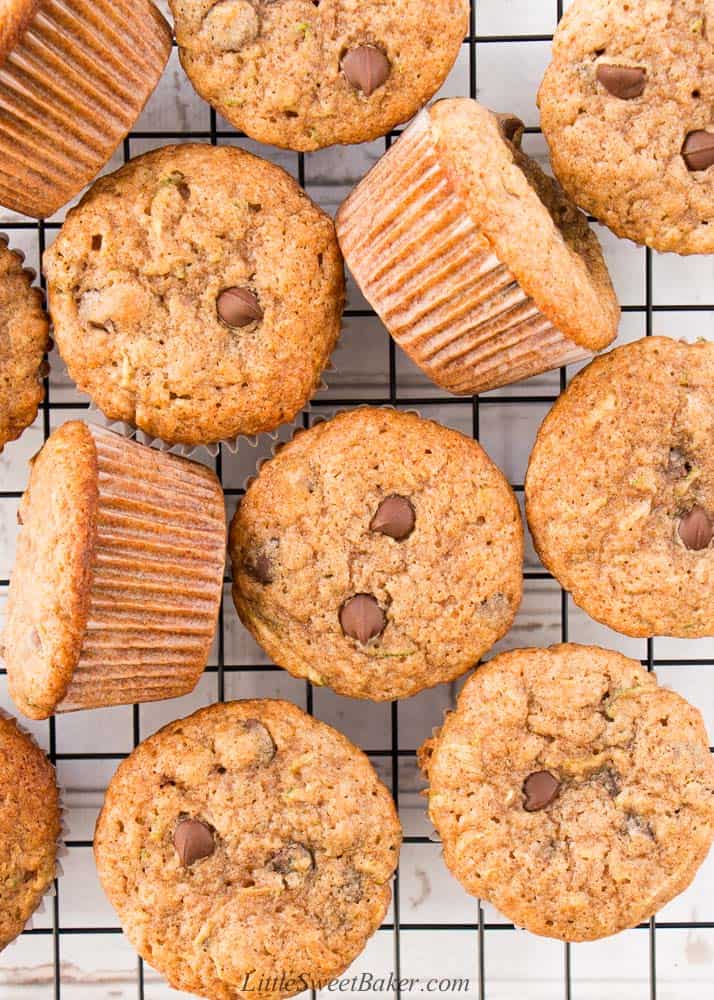 An overhead view of zucchini chocolate chip muffins on a cooling rack.