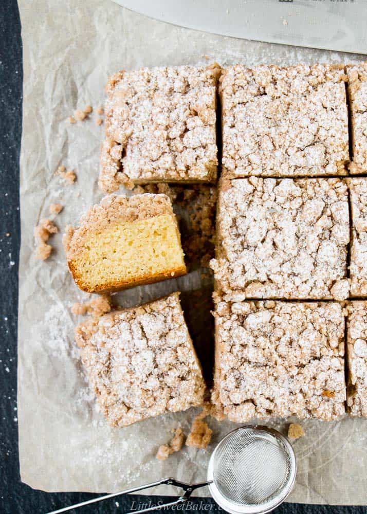A overhead view of a crumb cake cut into squares.