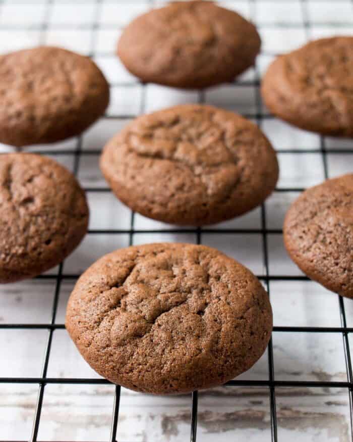 soft chocolate molasses cookies on a cooling rack