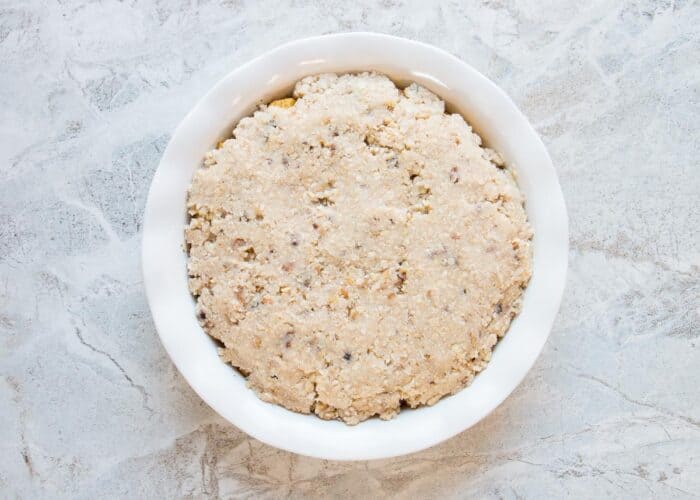 A Swedish apple pie with oatmeal topping read for the oven.