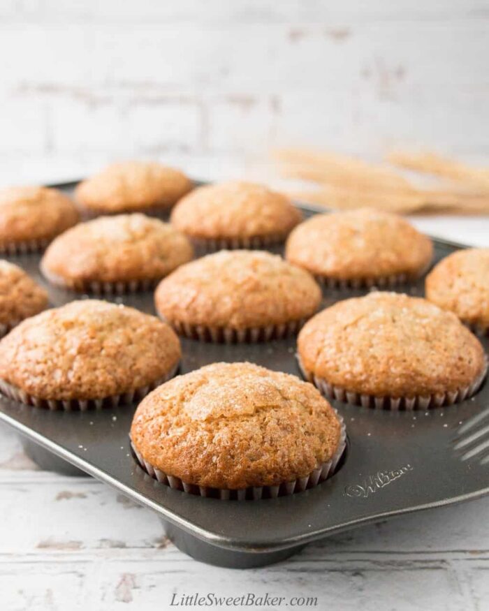 Moist and fluffy banana muffins in a muffin pan.