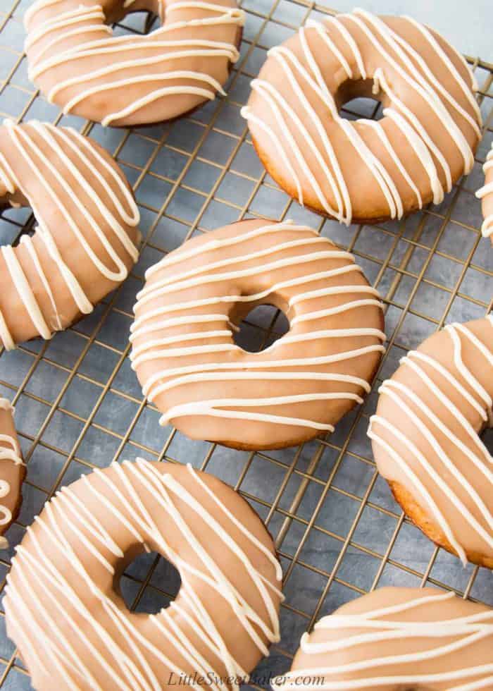 Glazed sweet potato donuts on a cooling rack.