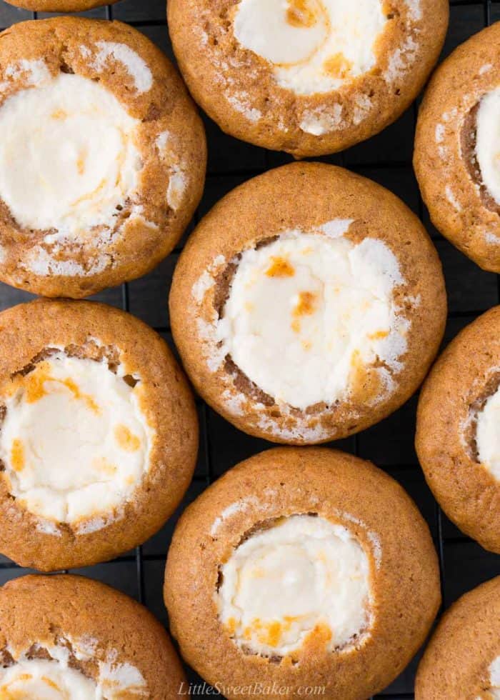 Overhead view of pumpkin muffins filled with cream cheese.