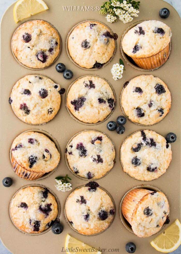 A golden baking pan of lemon blueberry muffins.