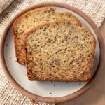 Two slices of banana bread on a plate.