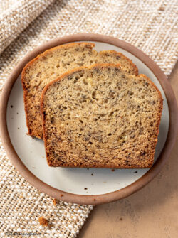 Two slices of banana bread on a plate.