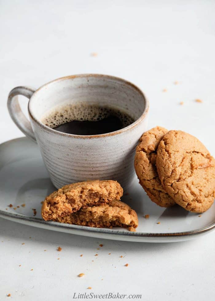 Healthy peanut butter cookies on a plate with a cup of coffee.